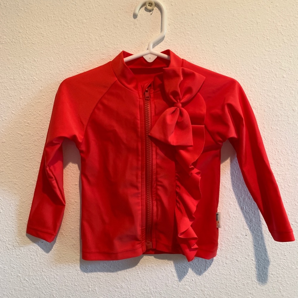 New red swipzip swim shirt with ruffles